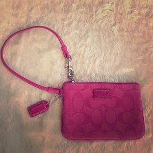 Coach wristlet magenta pink.